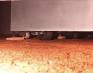 The base of the bomb was leveled on wood blocks.<br />Mercury switches and other triggering mechanisms<br /> would detonate the bomb if it were moved or tilted.