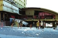 Emergency workers stand along U.S. Highway 50.<br />The first floor of the casino extends over the <br />valet parking entrance on the bottom floor.